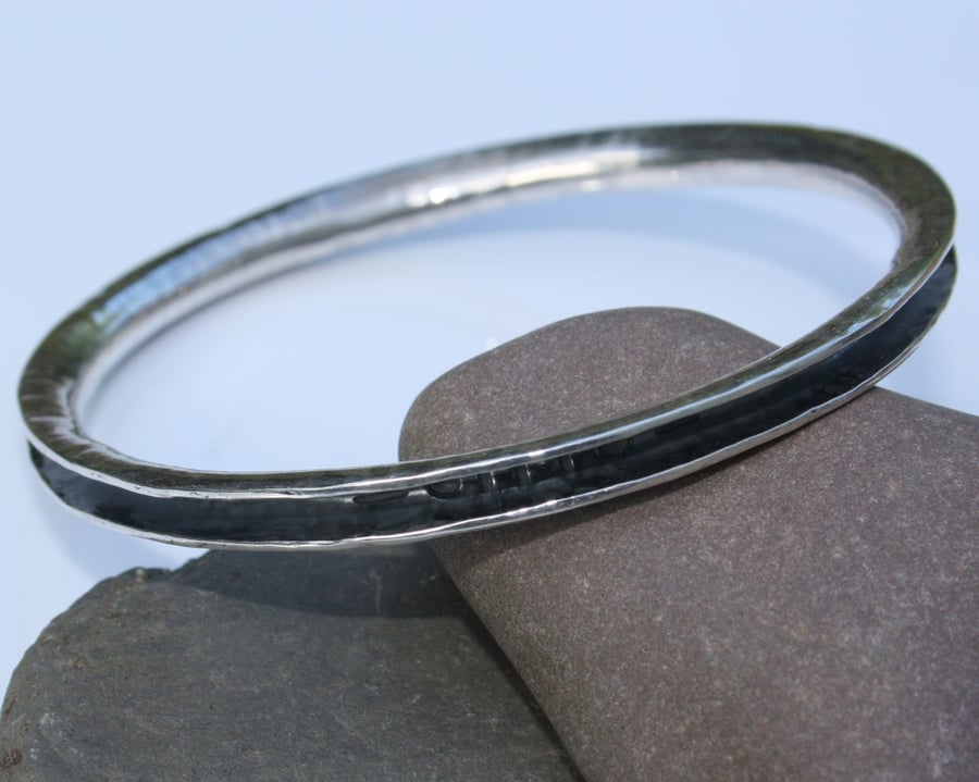 Sterling silver bangle , anticlastic  oxidised