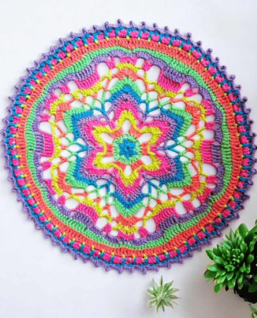 Large, bright crochet mandala doily table mat