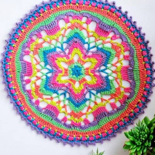Large, bright crochet mandala doily table mat