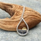 Silver teardrop sun rising over the sea pendant