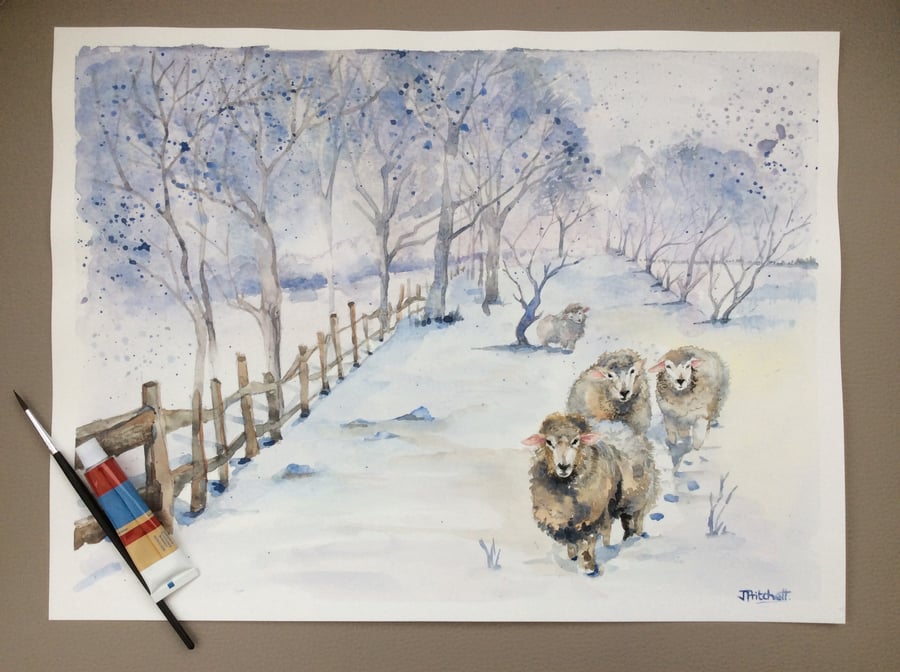 Original watercolour painting of winter landscape with sheep in snow.