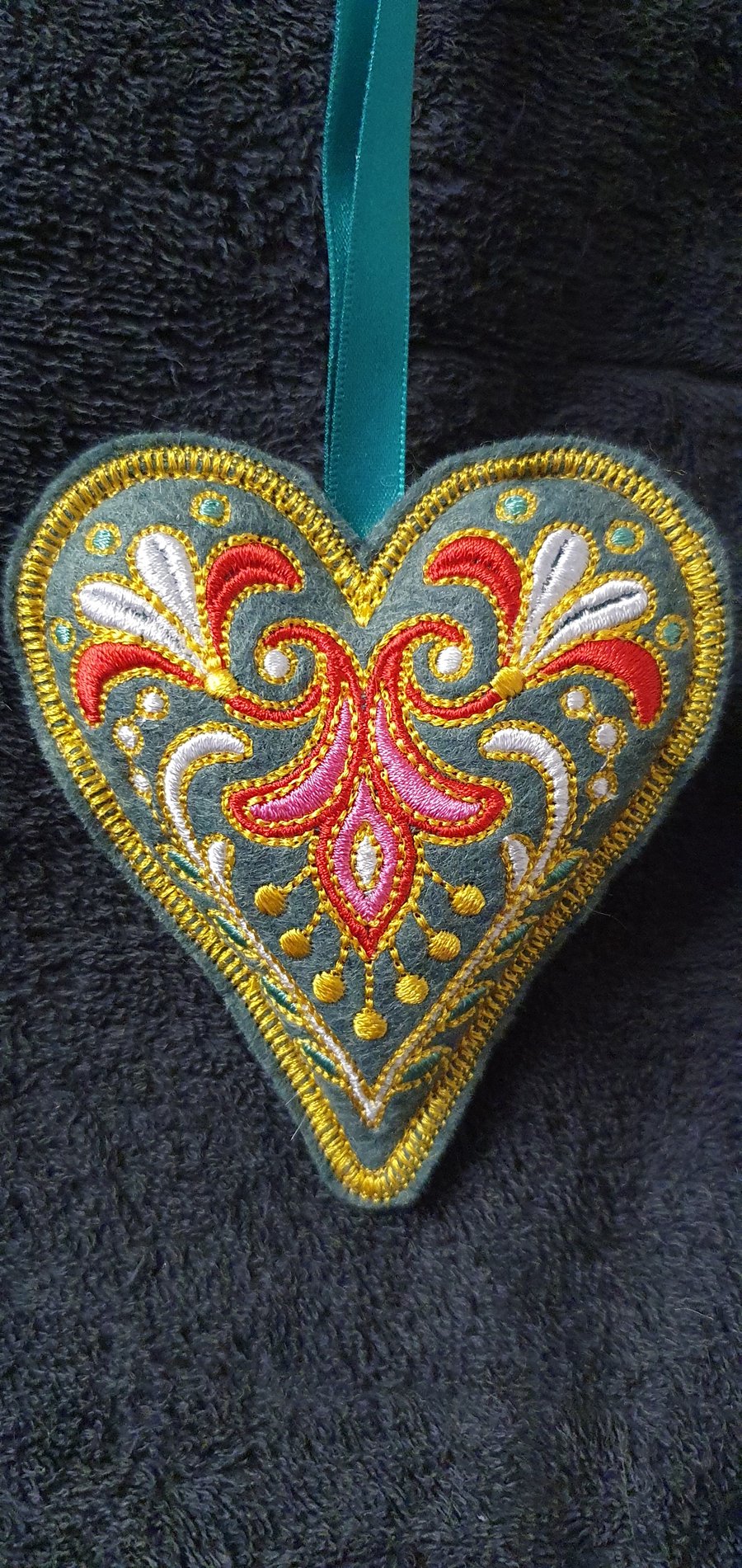 Embroidered felt decorations. Green.