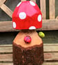 Spotty Toadstool with caterpillar