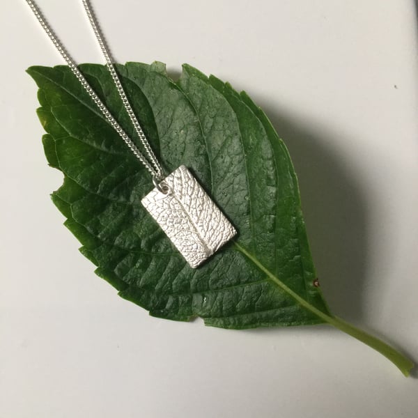 SOLD—-Sage leaf imprinted rectangle pendant