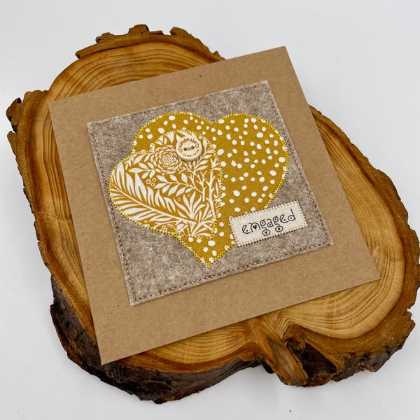 Appliqué engagement card with two interlocked hearts