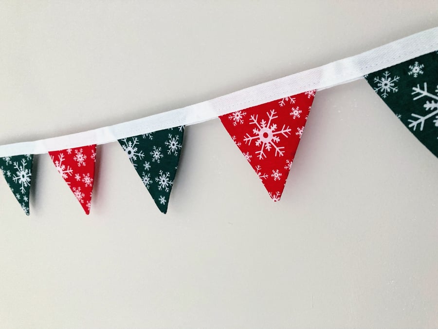 Red and green Christmas double sided fabric mini bunting with white snowflakes. 