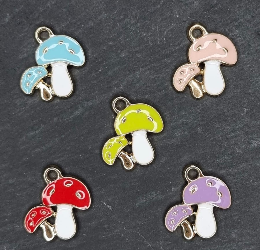 5 mixed enamel mushroom charms. 5 toadstool charms