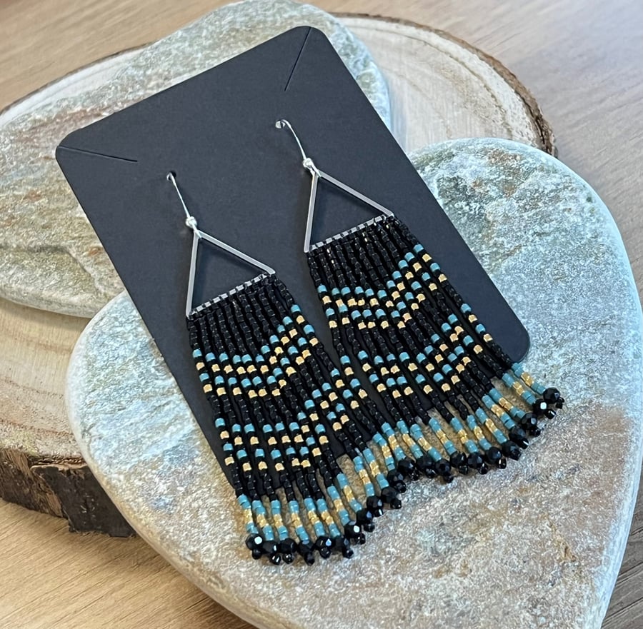 Beadwork fringe earrings in blue, black and gold with crystal drops