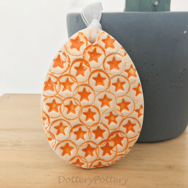 Pottery Easter Egg decoration with orange stars