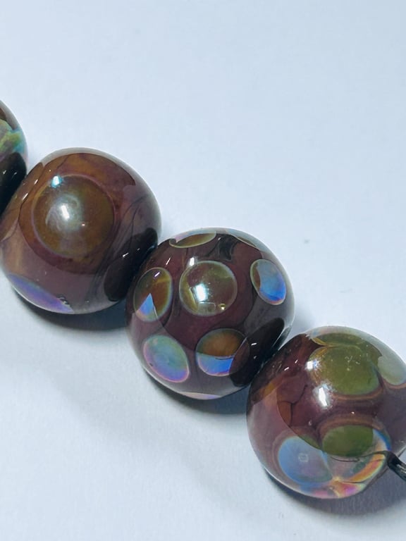 Handmade brown and iridescent patterned lamp work glass beads