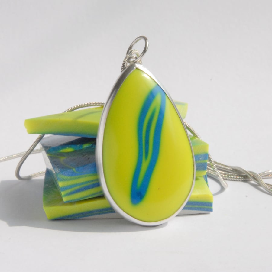 Bright yellow bowlerite and sterling silver pendant