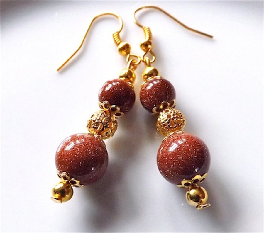 Earrings for pierced ears, gorgeous galaxy gold stone dangle.