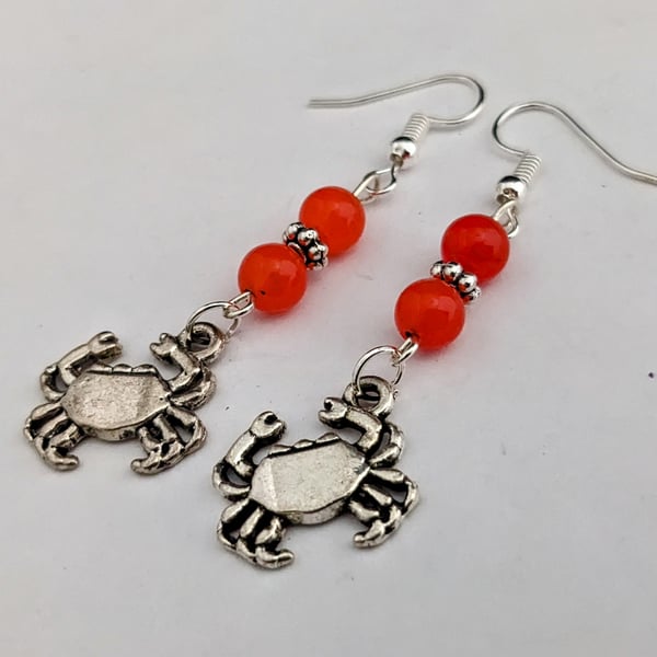 Crab earrings with orange jade beads