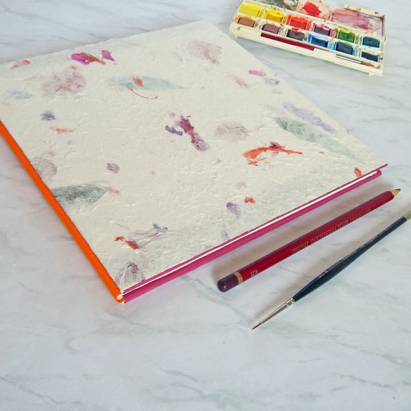 Sketchbook with Khadi paper. Handmade flower paper covers, orange spine. 