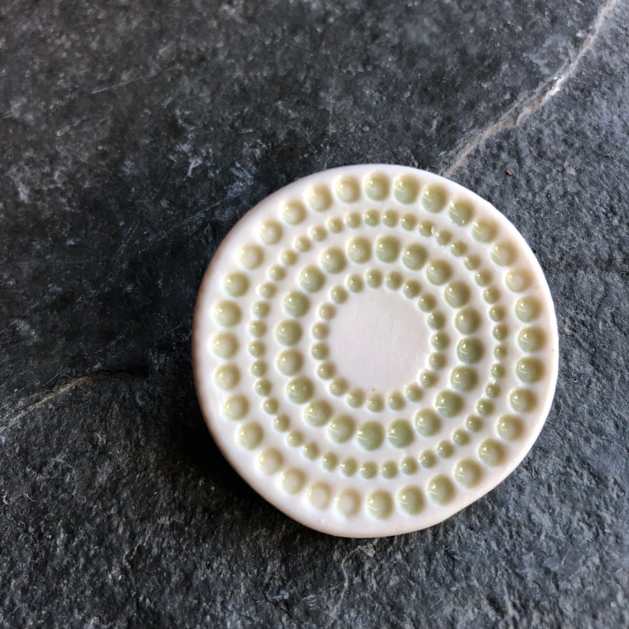 Spotty circles brooch, pale green glaze, white, porcelain, contemporary