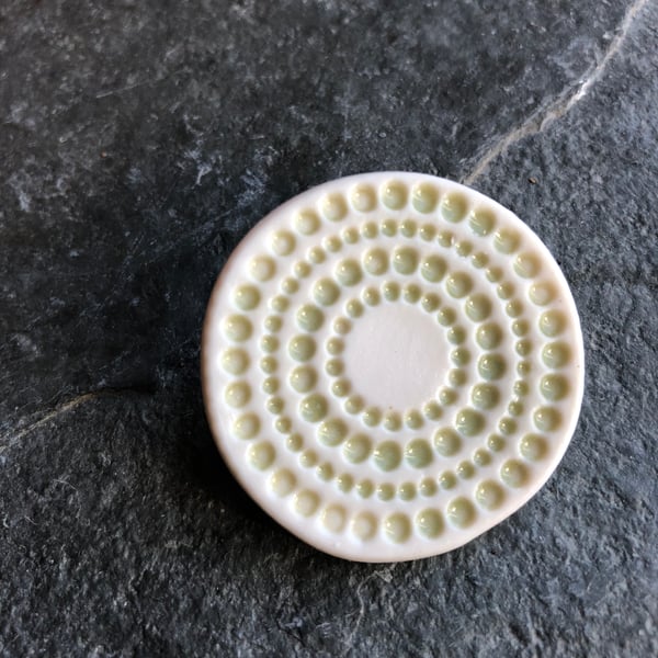 Spotty circles brooch, pale green glaze, white, porcelain, contemporary