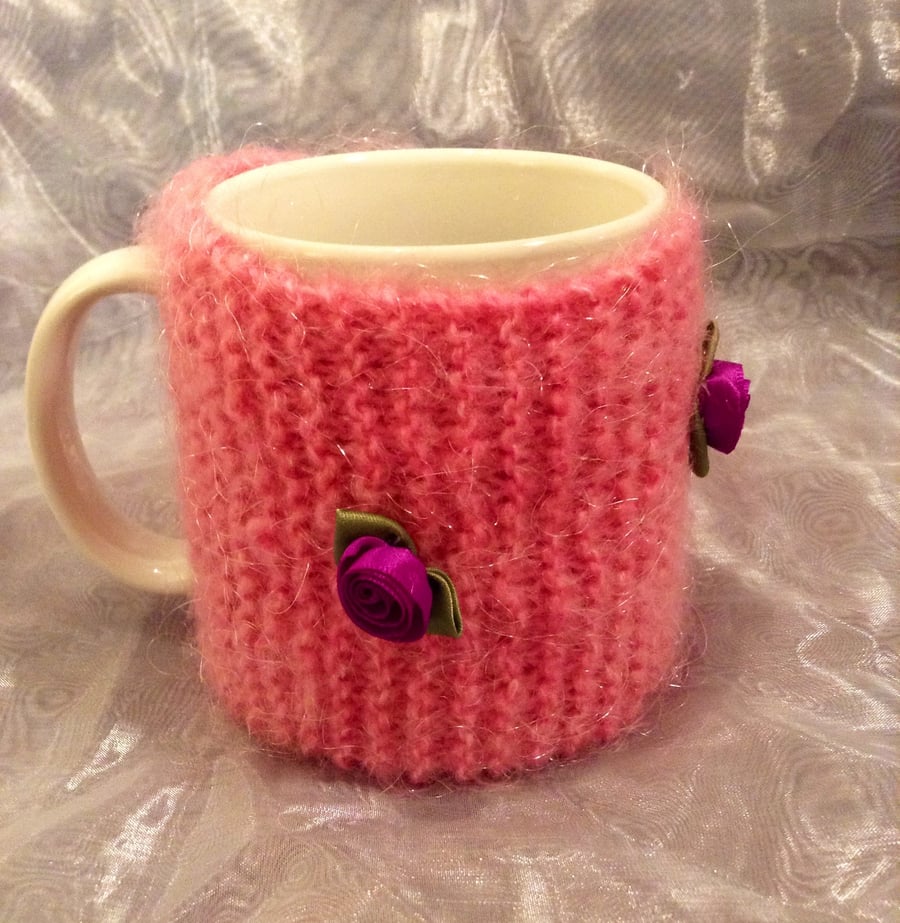 Pink knitted mug warmer