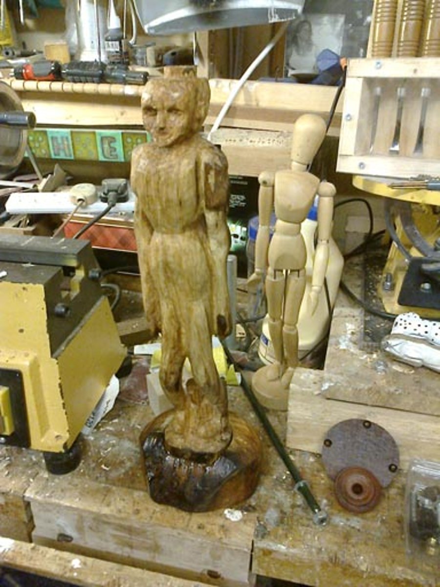 side lamp with a carved figure