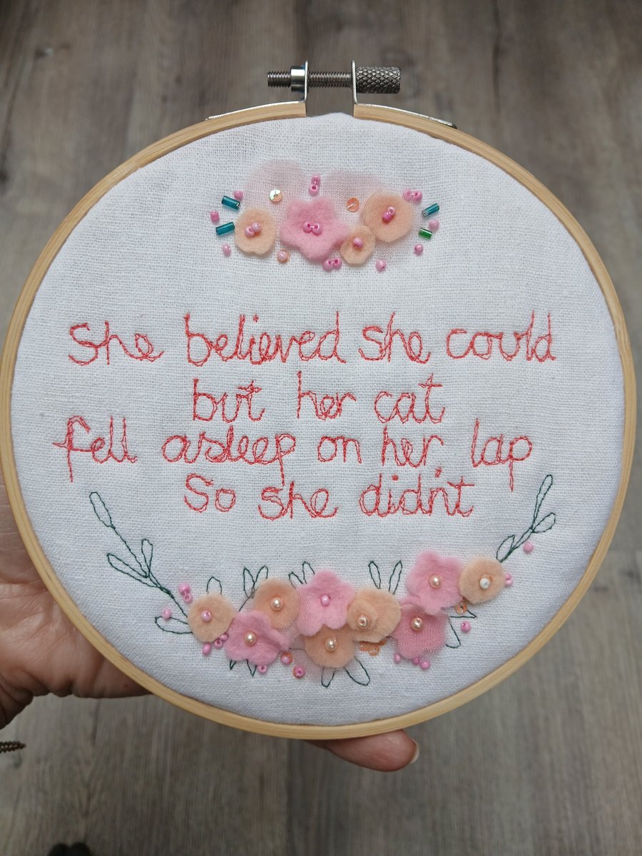 She believed she could but her cat sat on her lap