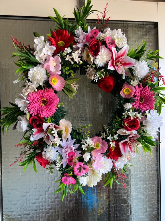 A pink and red door wreath