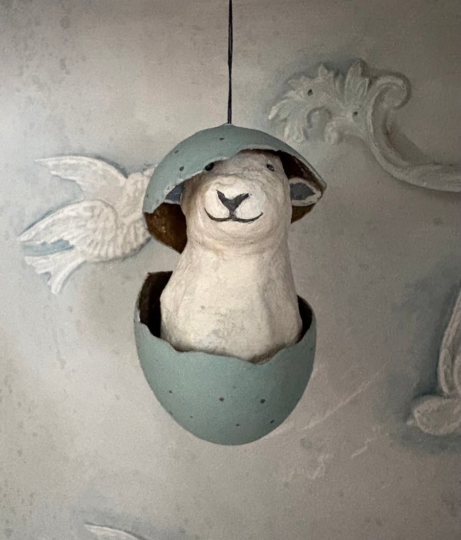 Paper mache sheep in an eggshell assemblage art