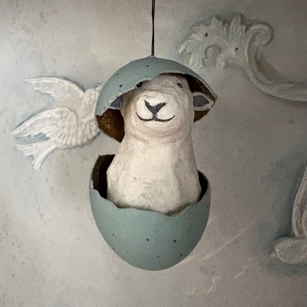 Paper mache sheep in an eggshell assemblage art