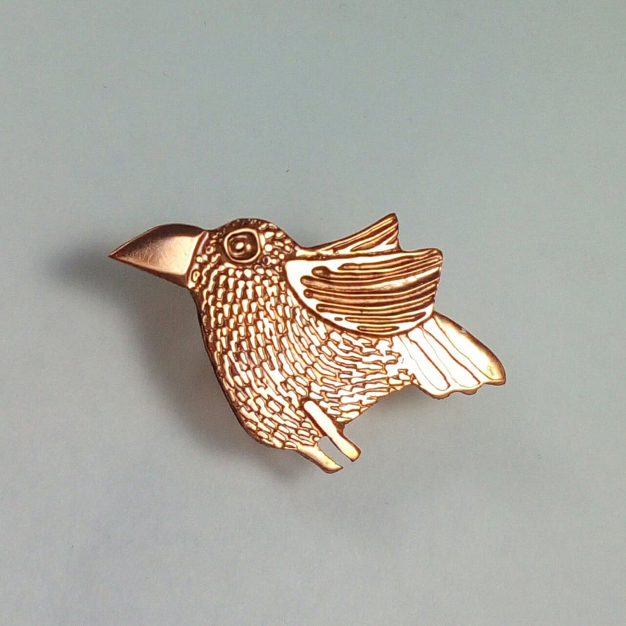 copper bird brooch