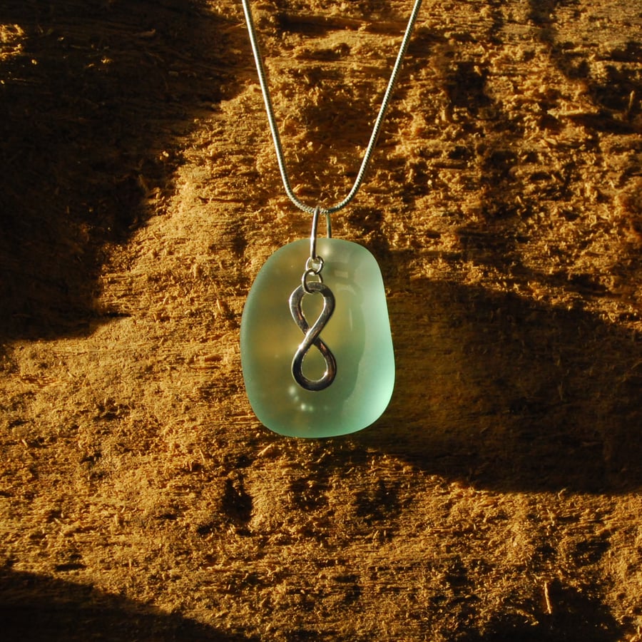 Aquamarine pendant with infinity charm