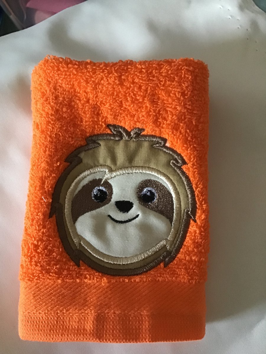 Orange Flannel with appliquéd Sloth face.