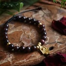 Chunky bracelet with 6mm Garnet beads and brass charm Hamsa Hand.