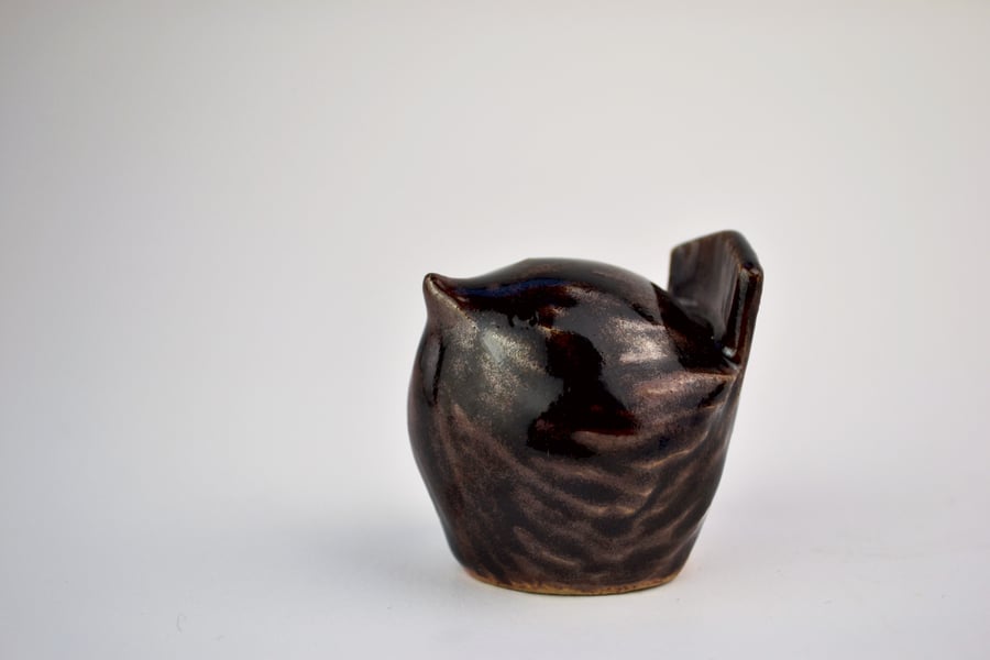 Shiny brown ceramic wren