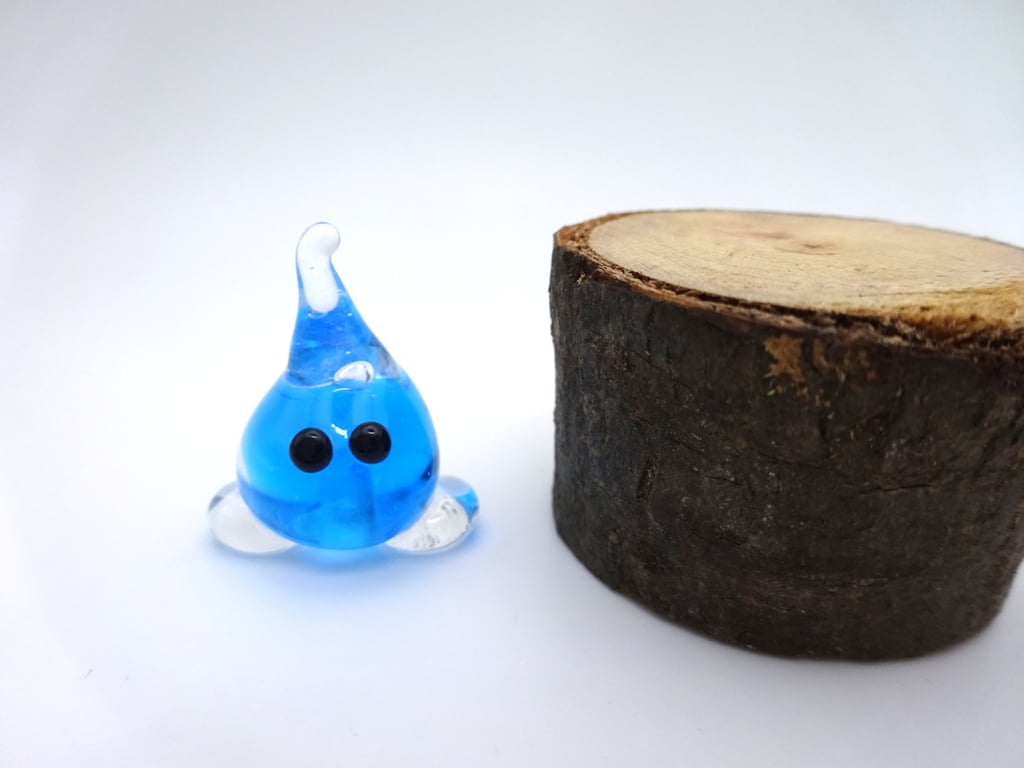 small glass wisp figure