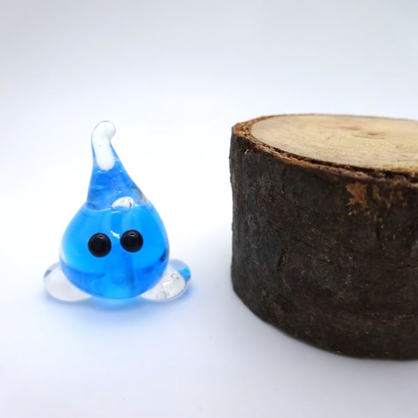 small glass wisp figure