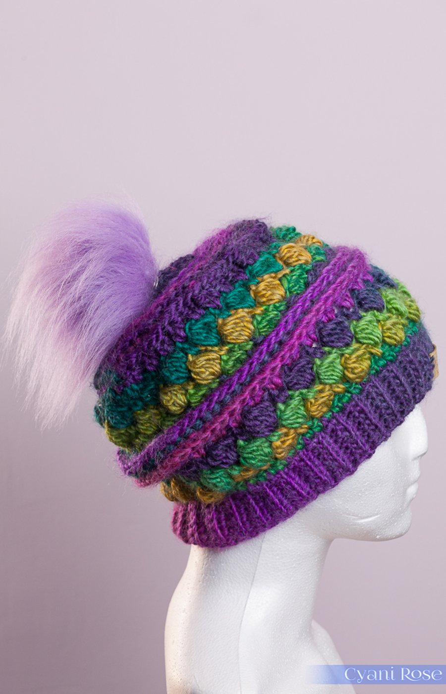 Cute crochet hat with handmade faux fur pompom rainbow bright