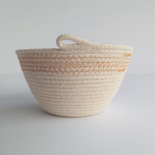 Freshwater Bowl, a coiled rope bowl with ochre stitched detail