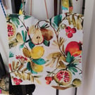 Handmade tote bag in a vivid fruit design.