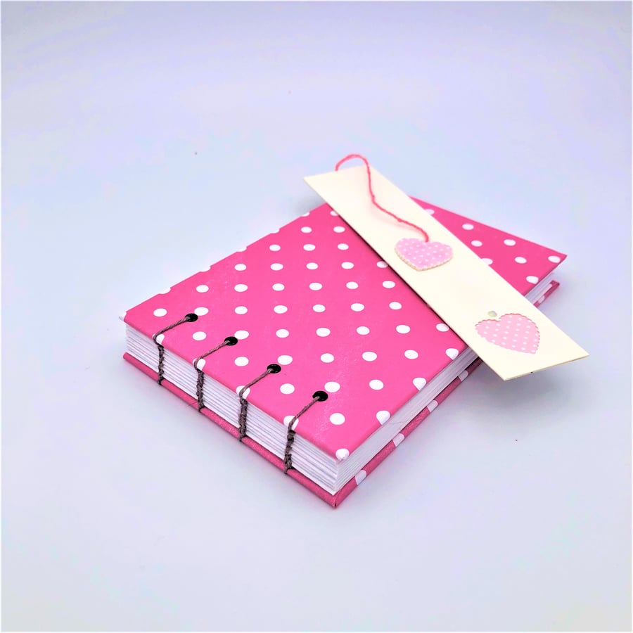 Dotty pink A6 coptic stitch notebook