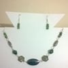 Multi shade green necklace and earring set with silver plated findings.