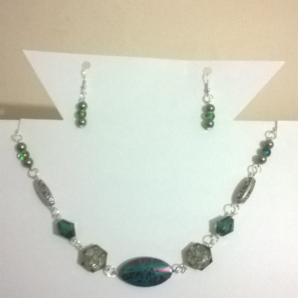 Multi shade green necklace and earring set with silver plated findings.