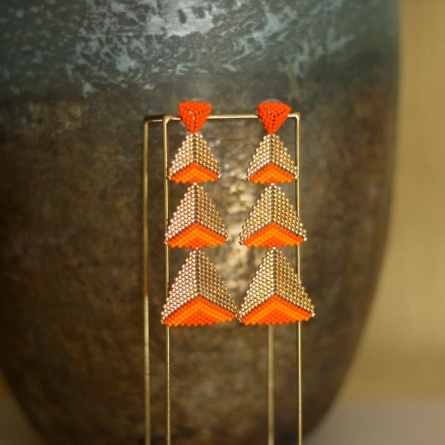 Orange and gold long handmade beaded statement earrings.