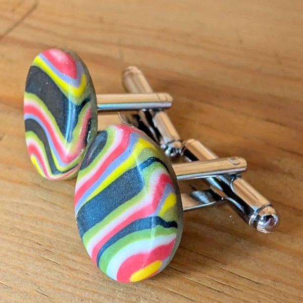 Retro style black, red and yellow striped cufflinks.
