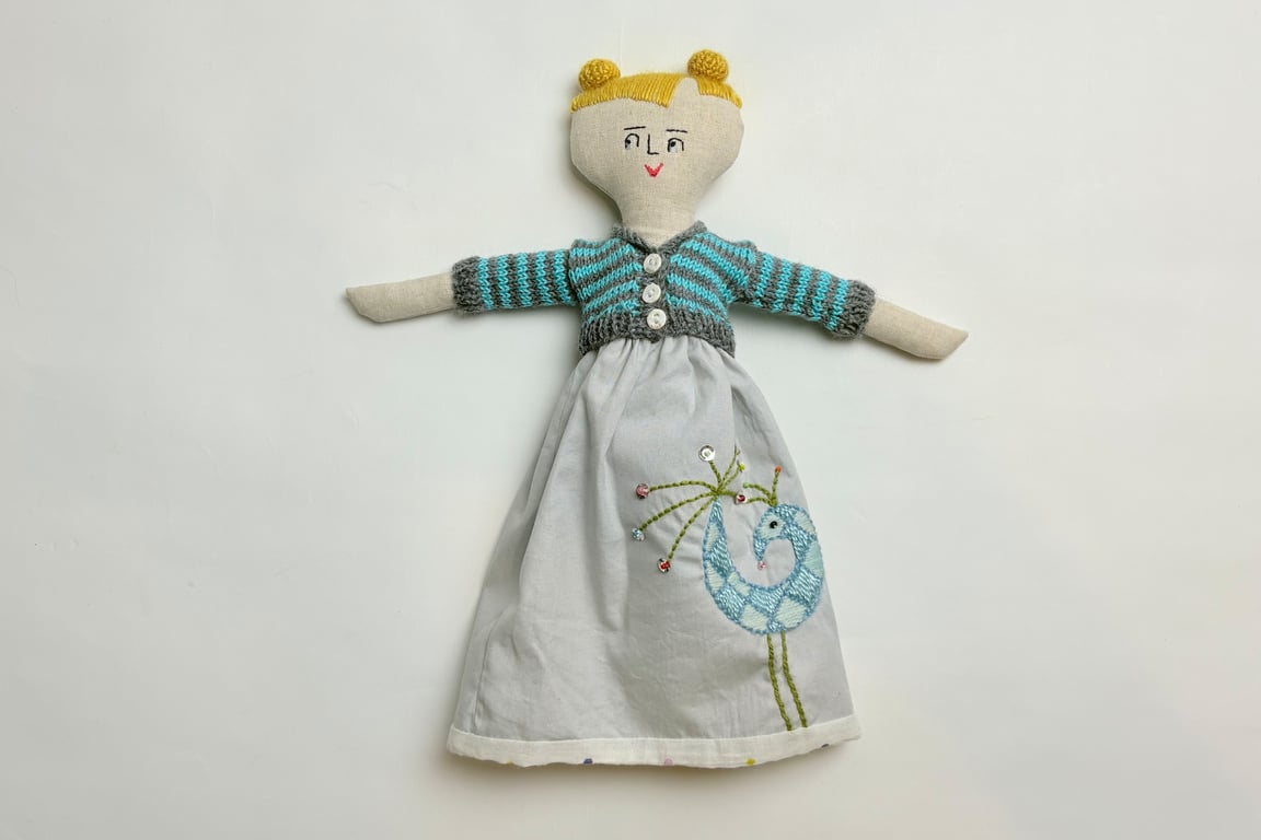 Nolene: 12" doll with hand embroidered bird on dress and matching accessories