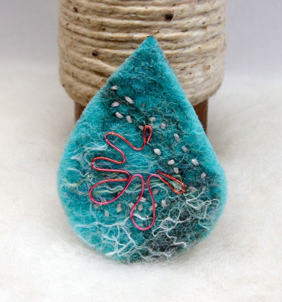 Hand felted teardrop brooch with pink and pale grey accents