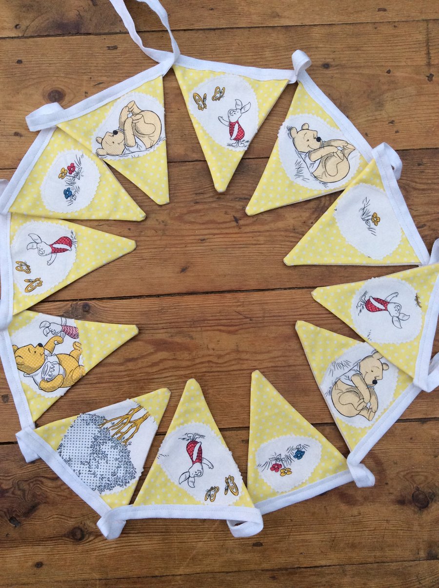 Bunting. Winnie the Pooh fabric appliqué on yellow dotty fabric. 12 Flags.