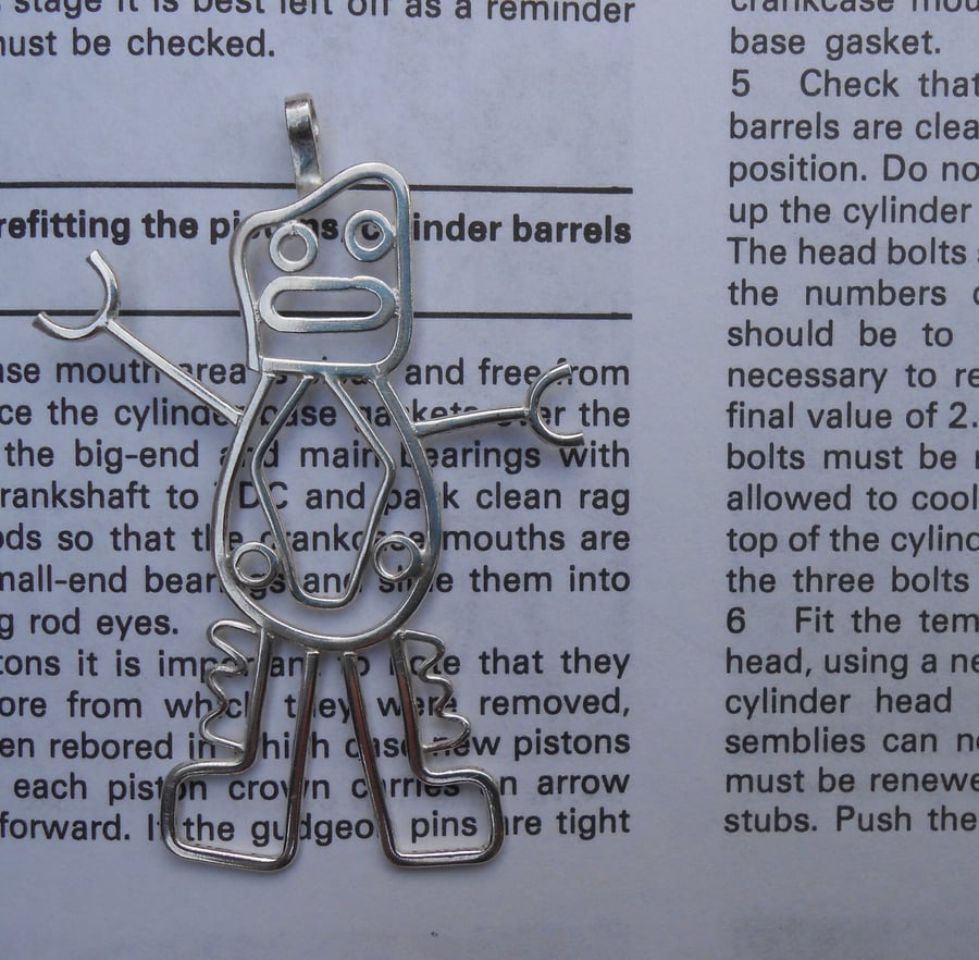A robot pendant from a child's drawing, designed from a kids doodle