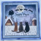 Santa Paws is coming to town 3 cats watching Santa Christmas card