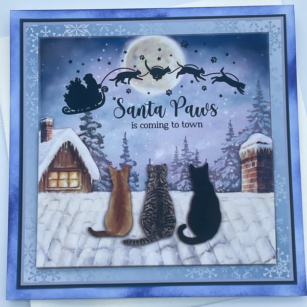 Santa Paws is coming to town 3 cats watching Santa Christmas card