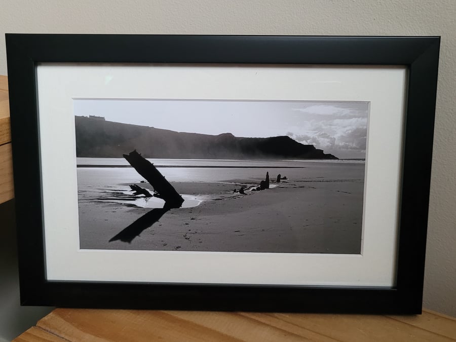 Framed photograph of the shipwreck Helvetia on Rhossili Beach in the Gower.