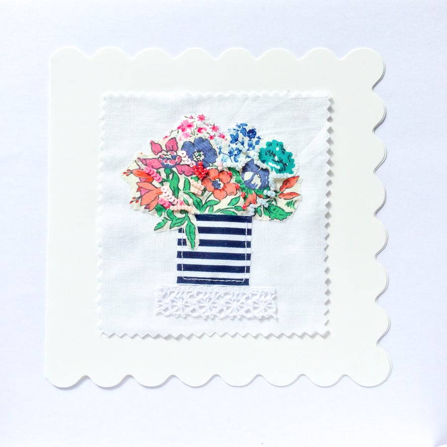 Textile card A vase of flowers.