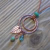 Aged copper 'rings and things' charm pendant 